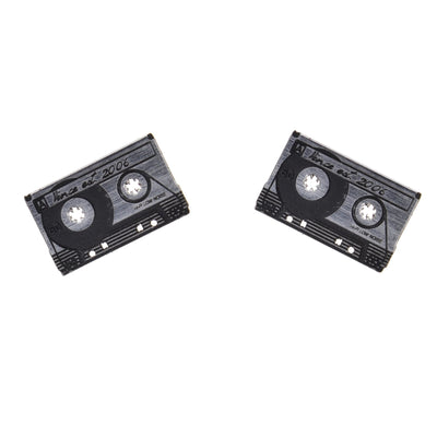 Silver tone, plastic cassette earrings on a white background.