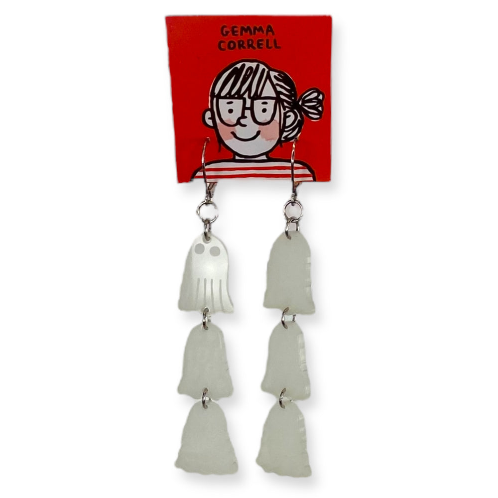 Pair of officially licensed Gemma Correll glow-in-the-dark ghost dangle earrings on a branded red card set against a white background.