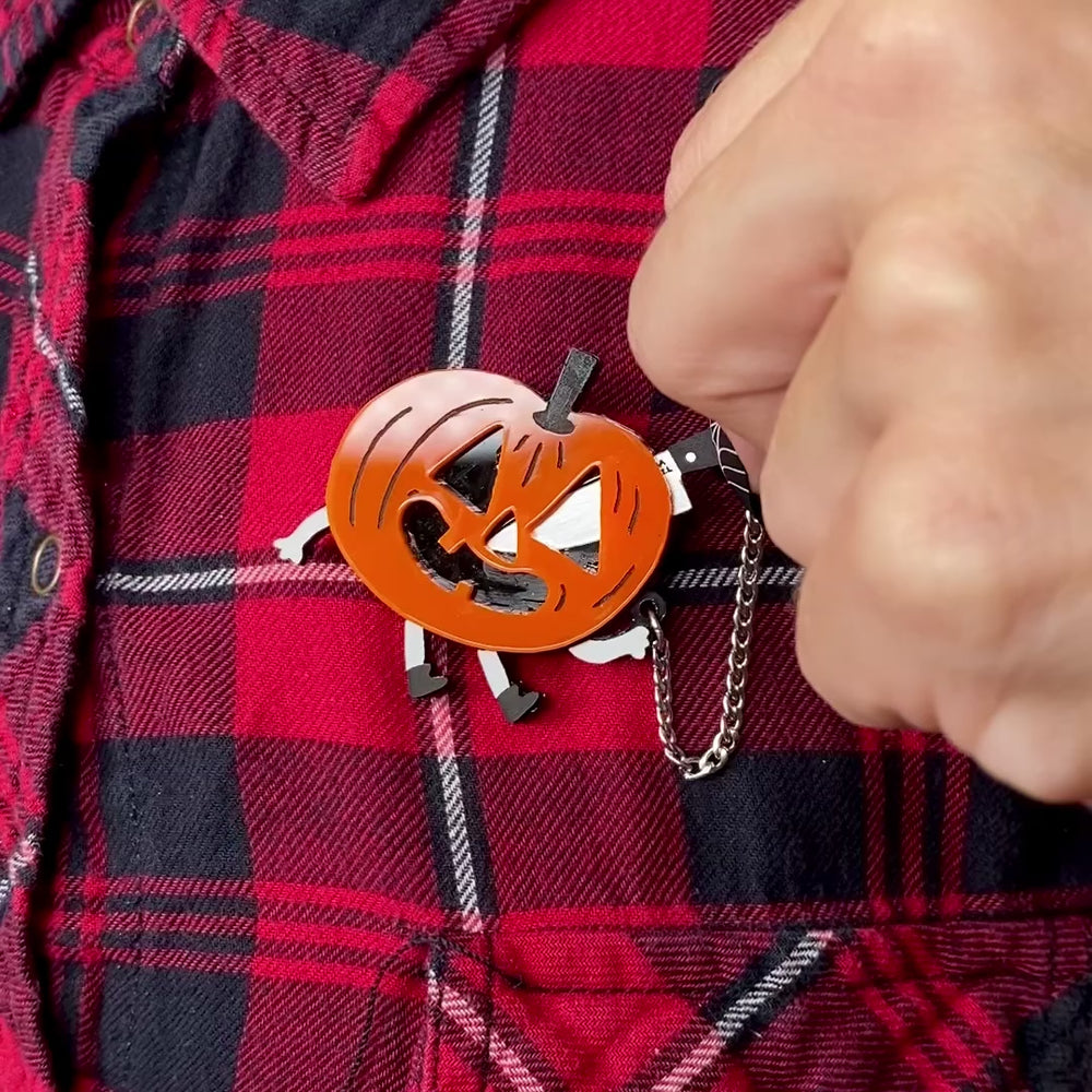 Gemma Correll spooky cute Jack-o-Lantern with kitchen knife brooch/lapel pin.