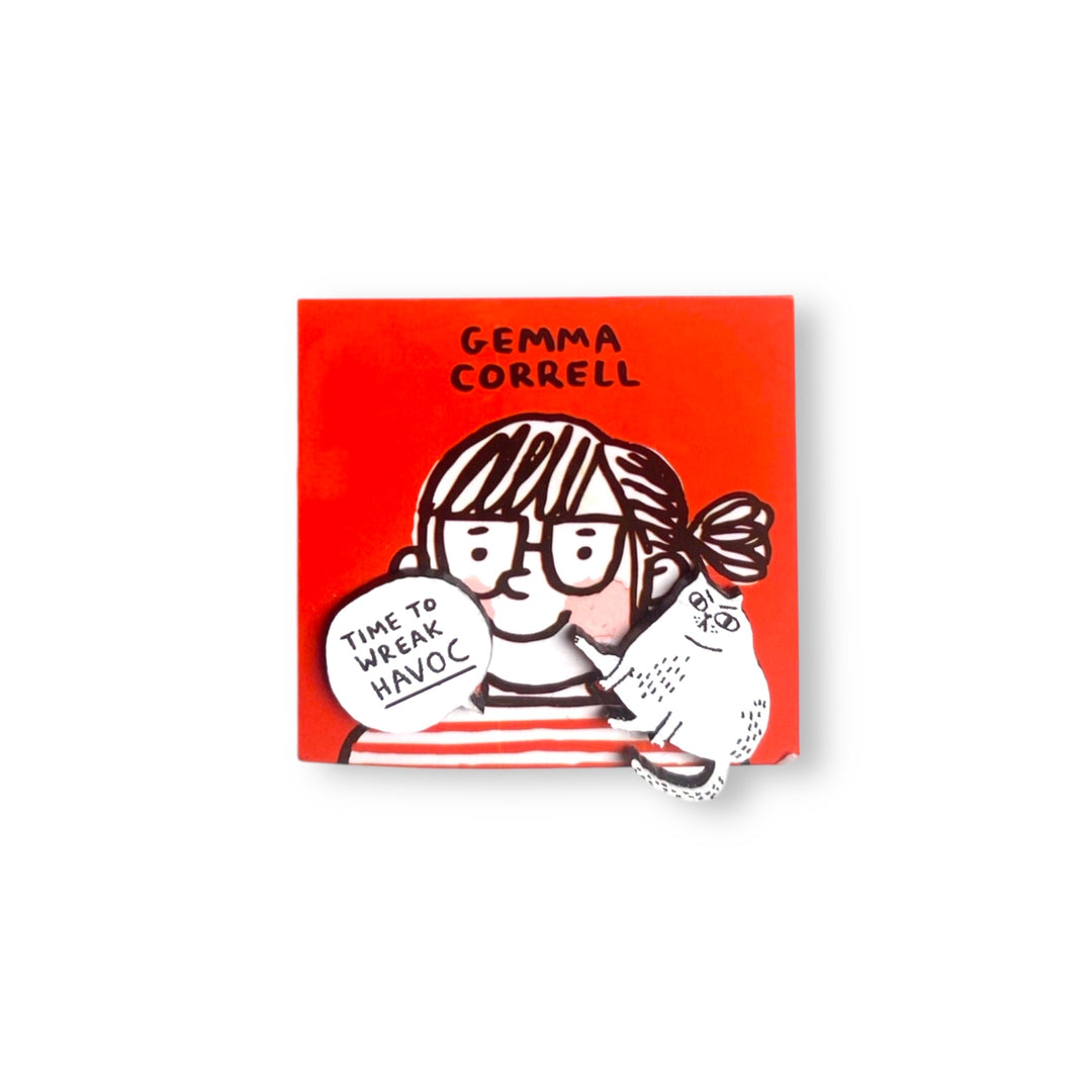 White cat and 'Time to Wreak Havoc' speech bubble asymmetrical earring set on a Gemma Correll branded red card.