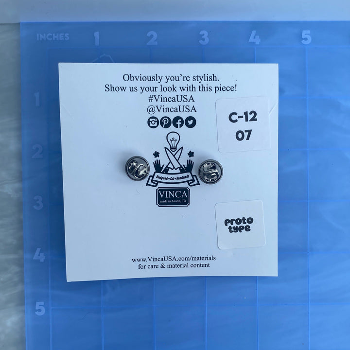 Prototype Fishbone lapel pin (bin C-12-07)