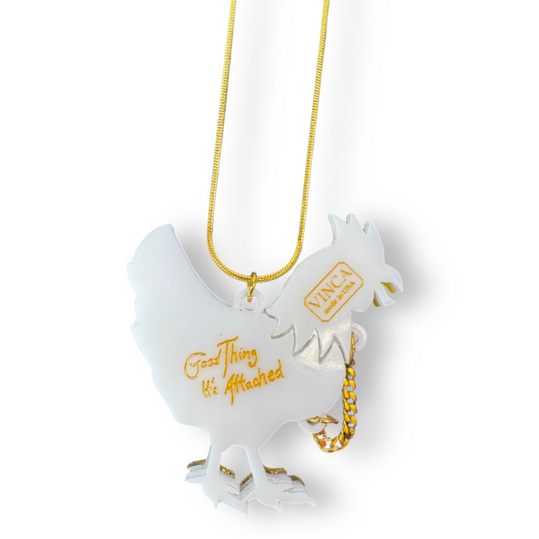 headless chicken pendant reads "Good thing it's attached" on the back side