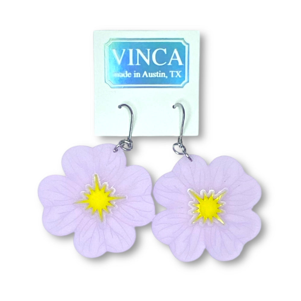 Buttercup Flower Dangle Earrings are shown on a white branded Vinca card and set against a white background.