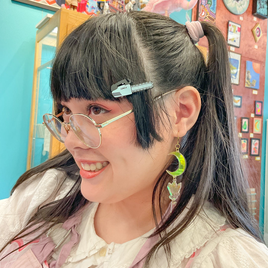 Chainsaw hair clip on a young woman with kawaii style. 