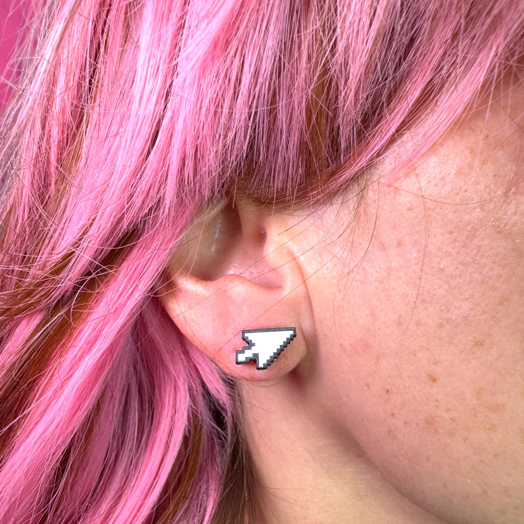 alt fashion model wears cursor arrow earrings