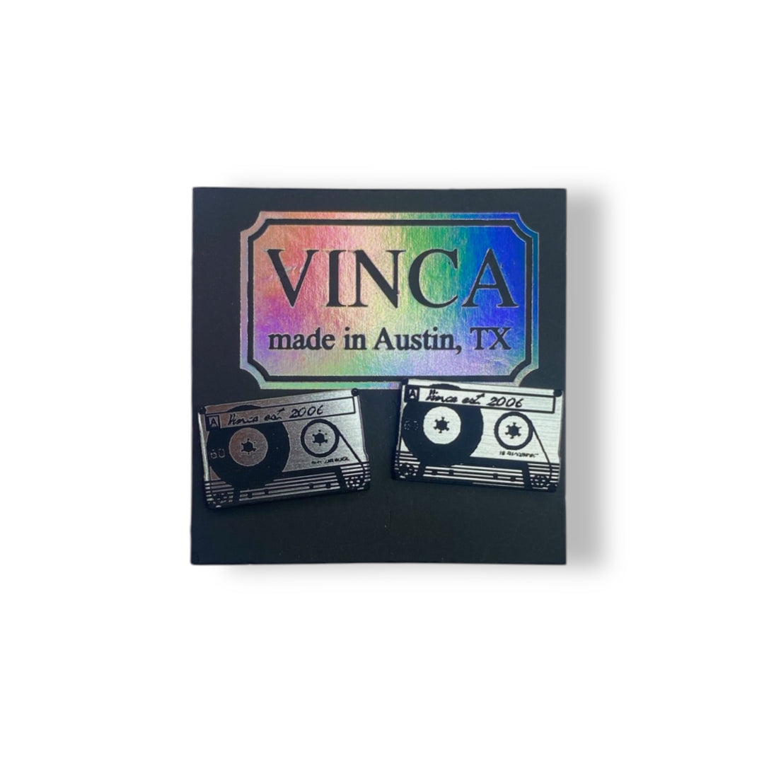 Cassette tape stud earrings on a Vinca branded card set against a white background.