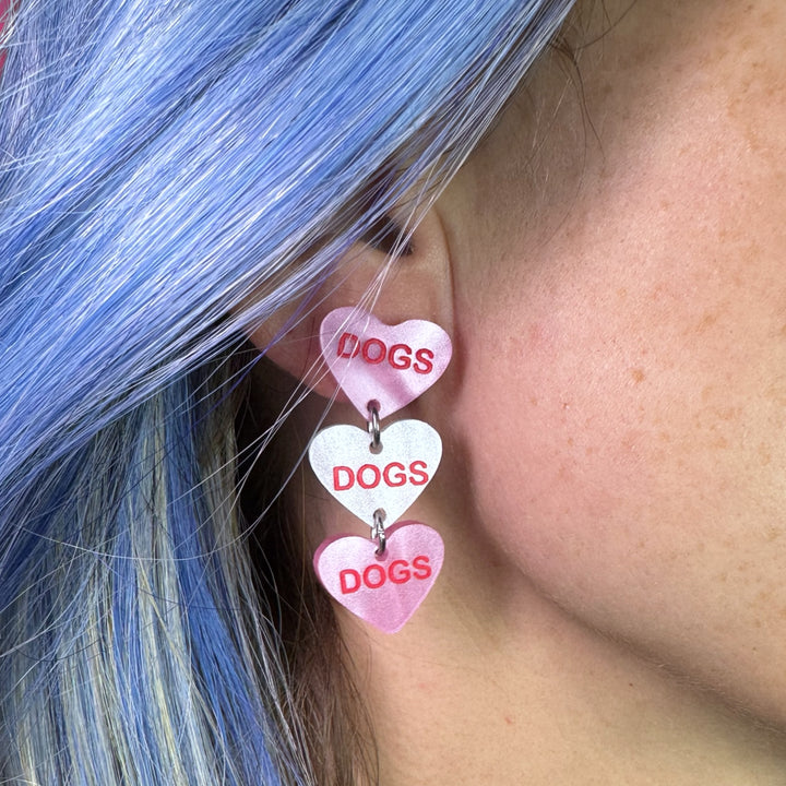 Handmade Valentine candy heart dogs earrings in pink and white with surgical steel posts. 