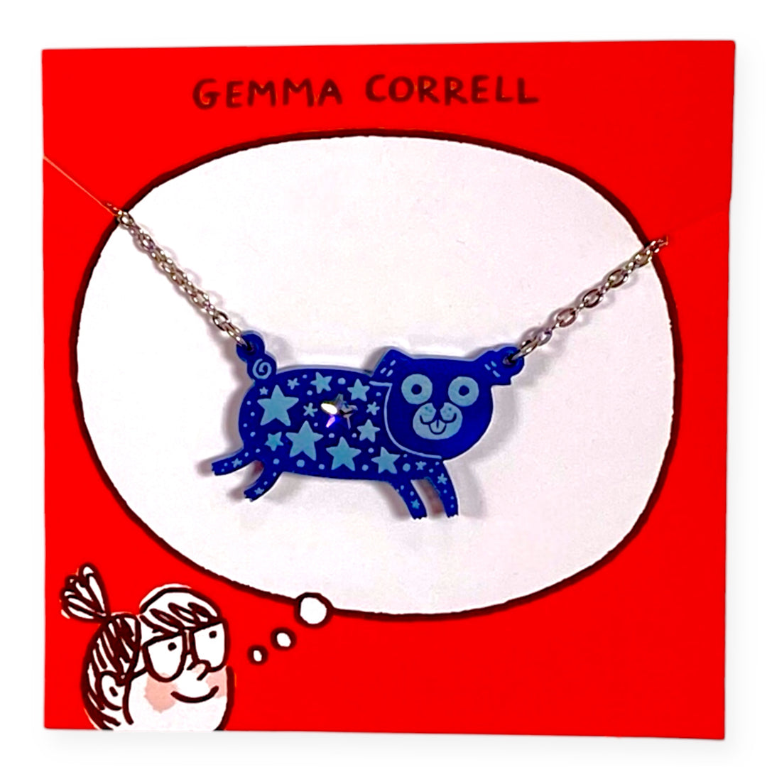 Blue pug dog pendant with star detail necklace on a red card branded with 'Gemma Correll' text.