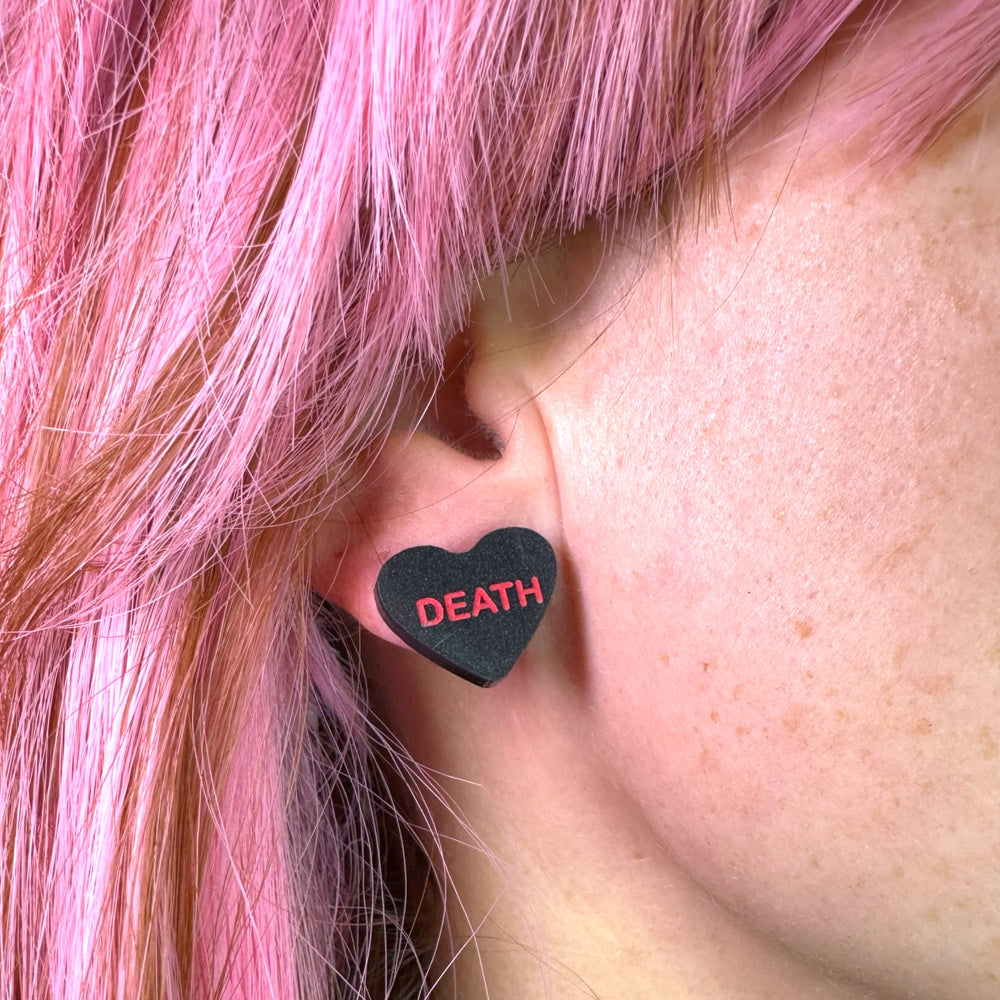 Valentine goth candy heart earrings in pearl black Death with surgical steel posts. 