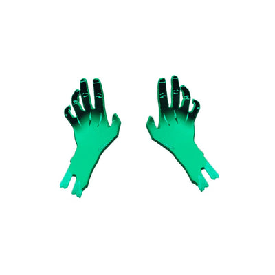 Mirrored green zombie hand stud earrings, reaching up.