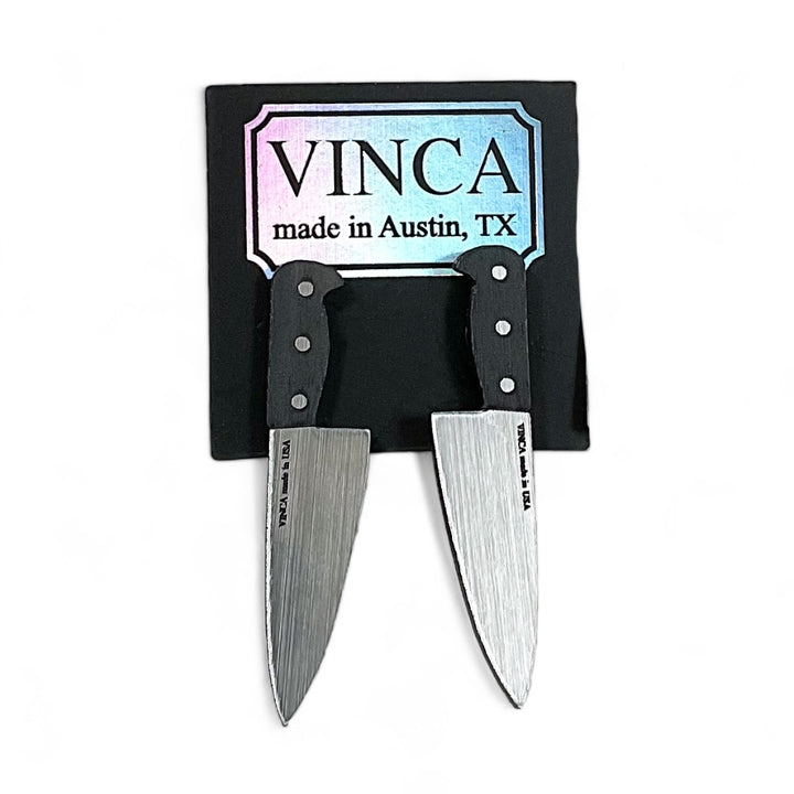 The original 2" Chef's Knife earrings on a branded Vinca card. 