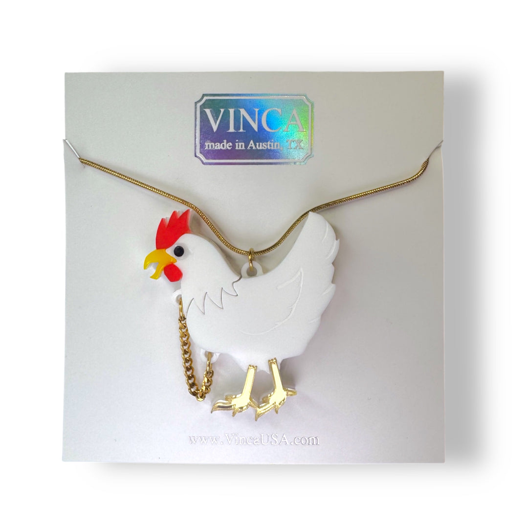 handmade weird headless chicken necklace on Vinca package