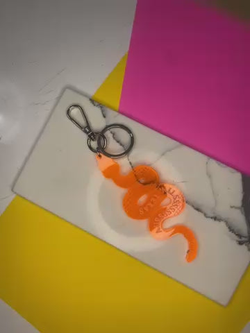Sample Rattlesnake Keychain in transparent orange (D-1022)