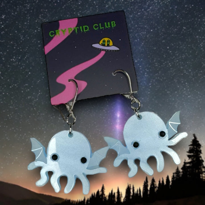 Sarah's Scribbles Cryptid Club handmade Cthulhu dangle earrings in pearl blue with stainless steel findings.