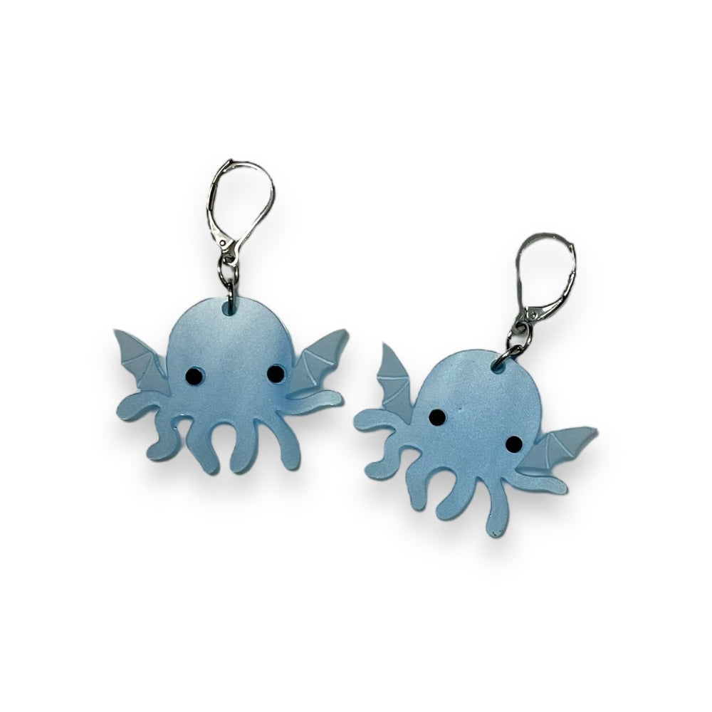 Sarah's Scribbles Cryptid Club handmade Cthulhu dangle earrings in pearl blue with stainless steel findings.