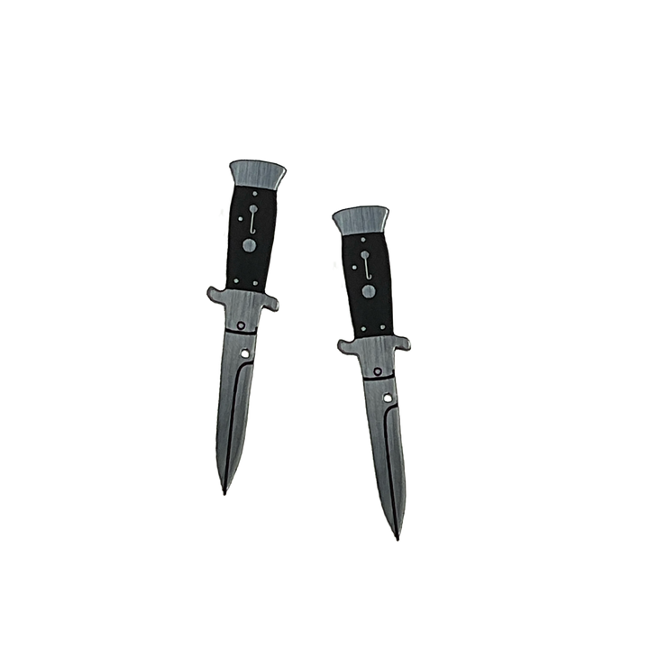 Silver tone switchblade knife earrings on a transparent background.