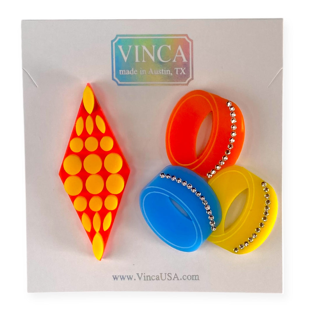 Colorful Twiggy-inspired earrings with crystal detail on a white background with 'VINCA made in Austin, TX' branding.