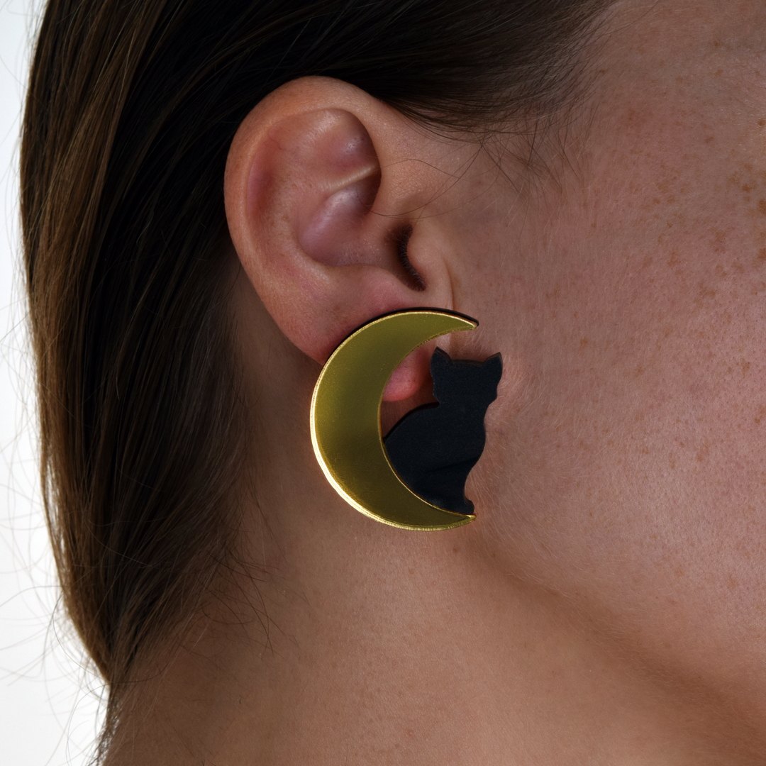 Extra large Cat in Moon earring on a human ear. 