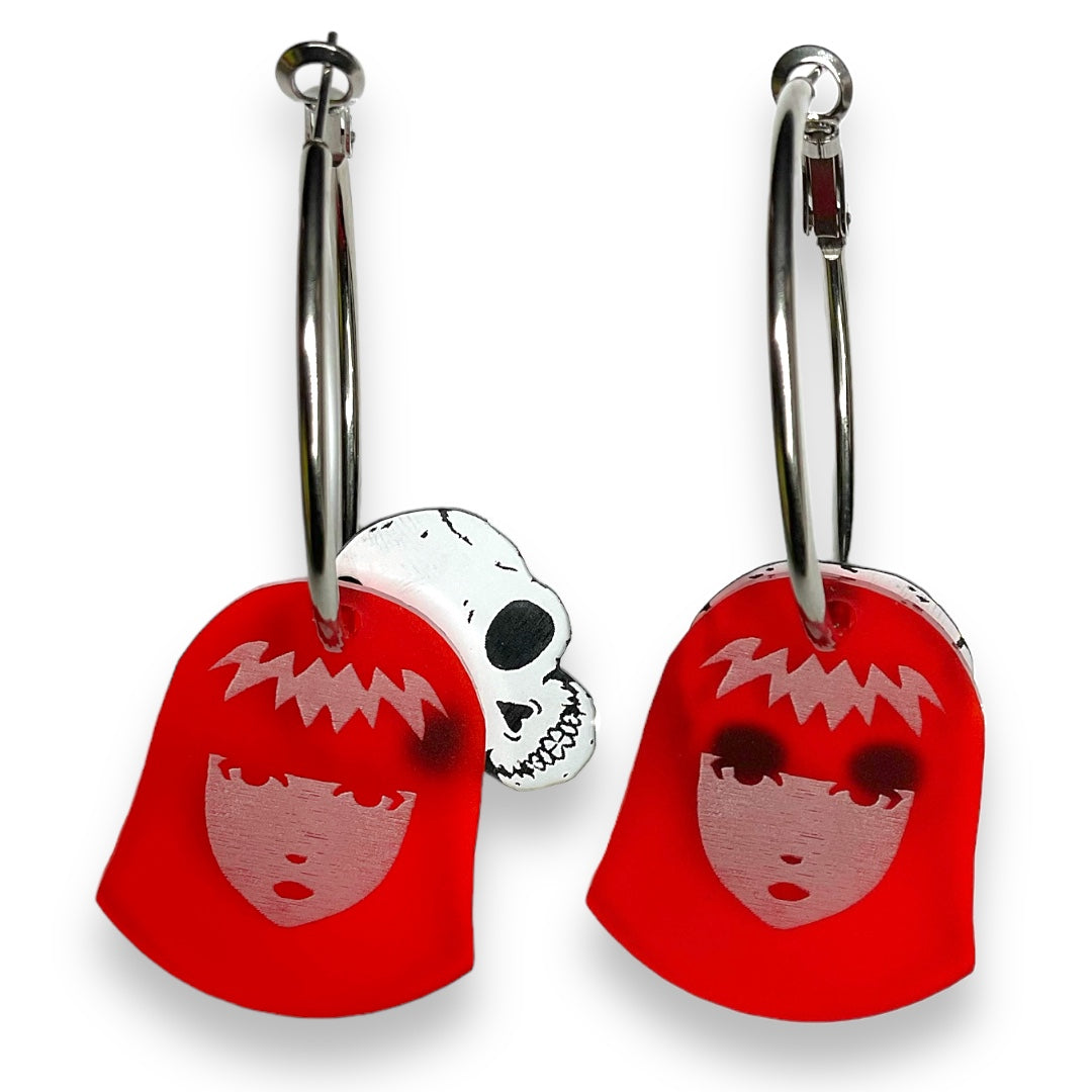 Our officially licensed Emily the Strange X-Ray Emily Skull Hoop Earrings set against a white background. 