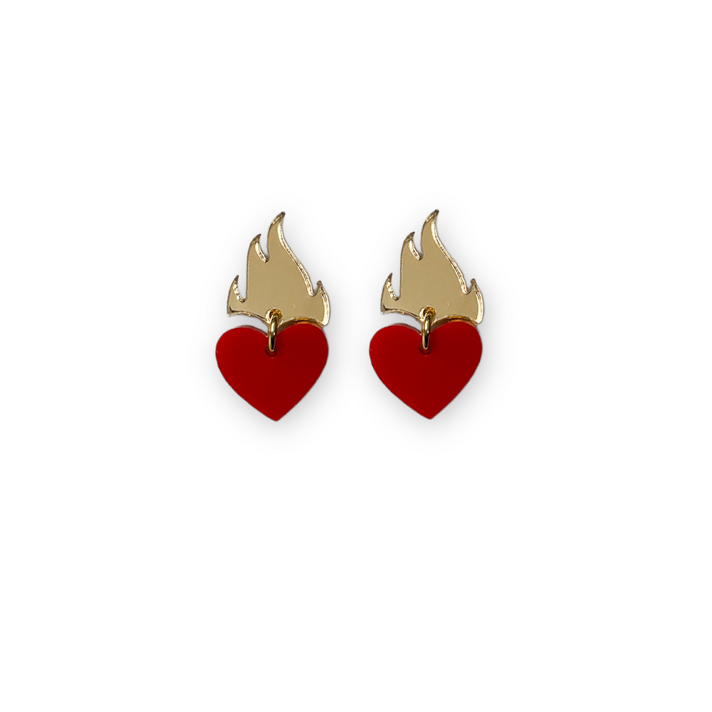 Flaming heart earrings in red and gold on a white background