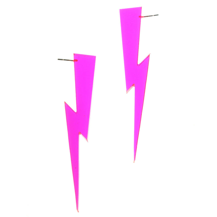 Neon pink lightning bolt earrings floating on a white background.