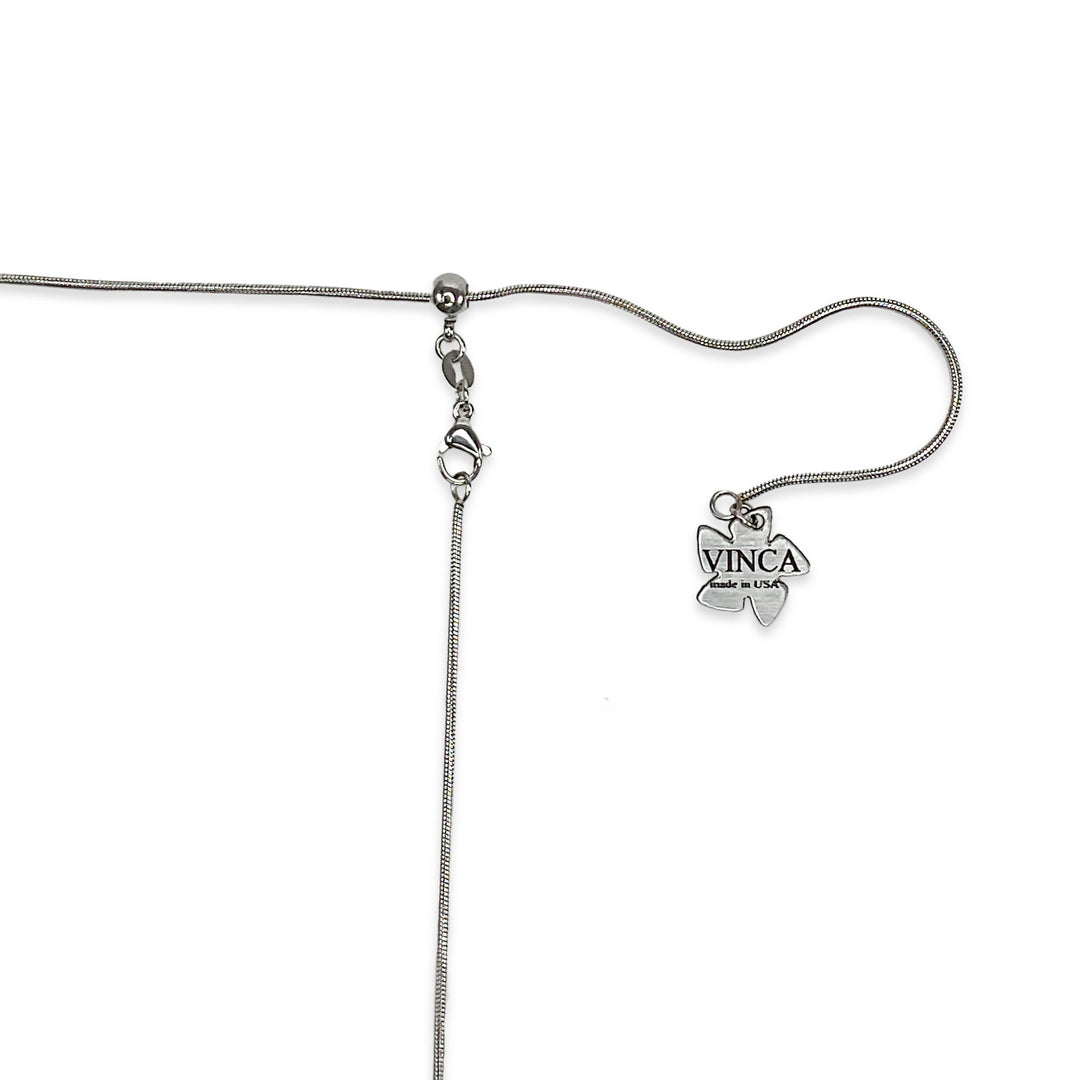 A closeup shot of our stainless steel snake chain with our Vinca branded hangtag.